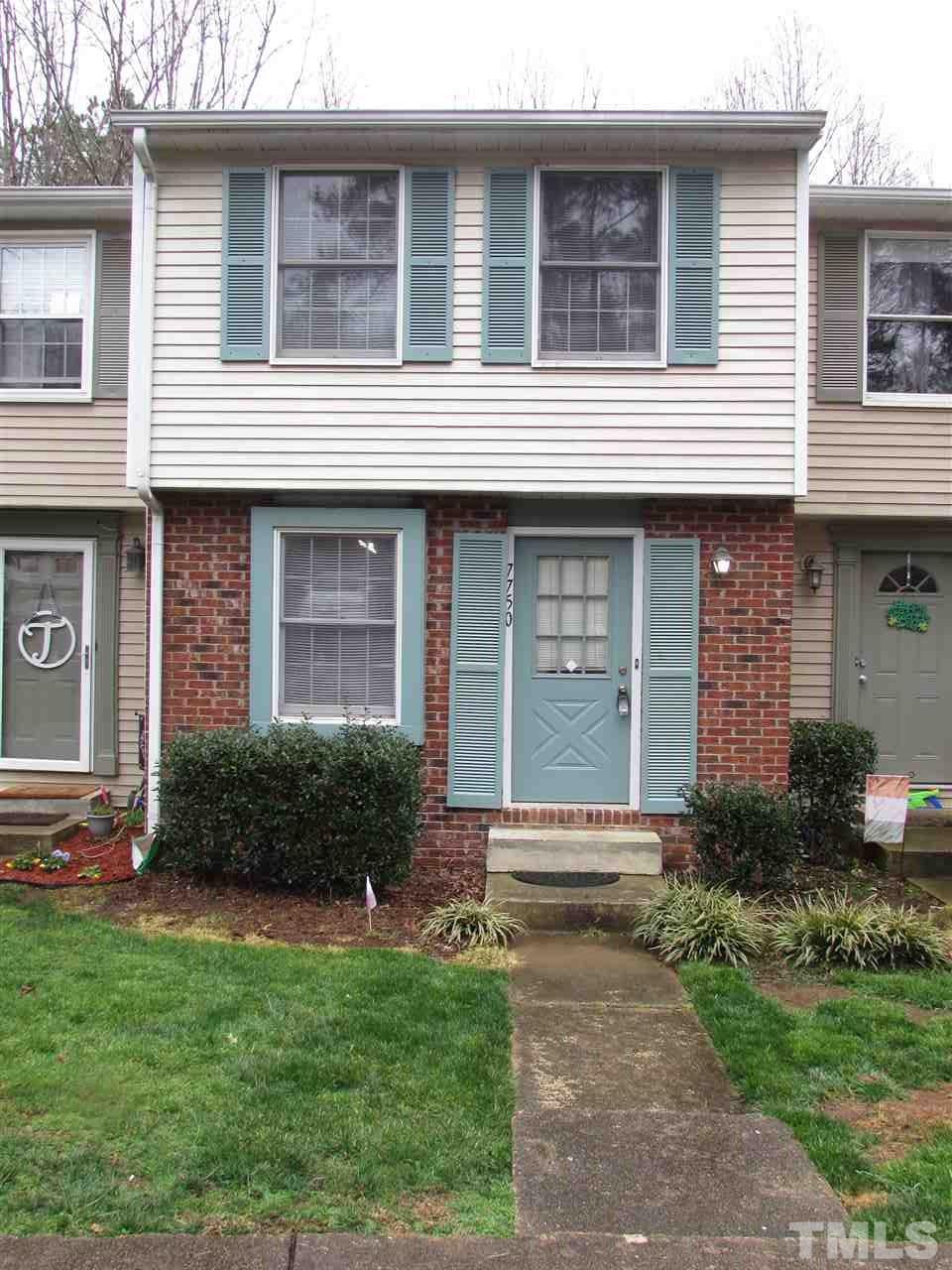 7750 Sandra Lane Raleigh, NC 27615 - Photo 1 of 25 a front view of a house with a yard