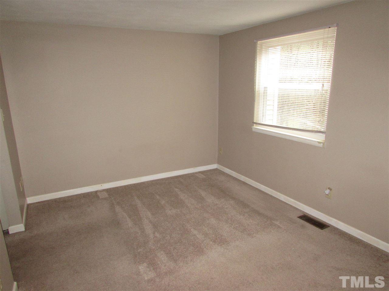 7750 Sandra Lane Raleigh, NC 27615 - Photo 14 of 25 an empty room with a window