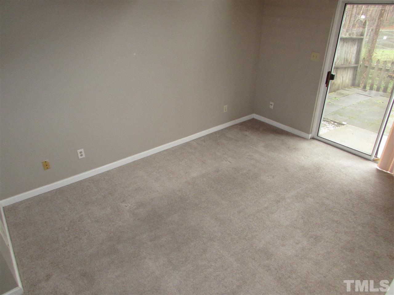 7750 Sandra Lane Raleigh, NC 27615 - Photo 18 of 25 a view of an empty room with a window
