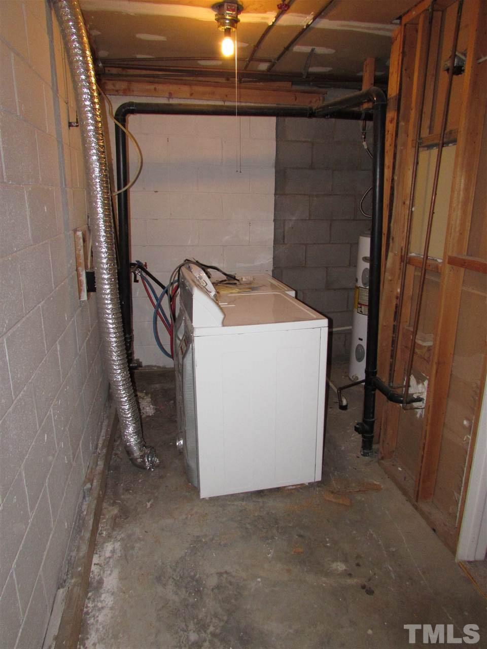 7750 Sandra Lane Raleigh, NC 27615 - Photo 20 of 25 a utility room with dryer and washer