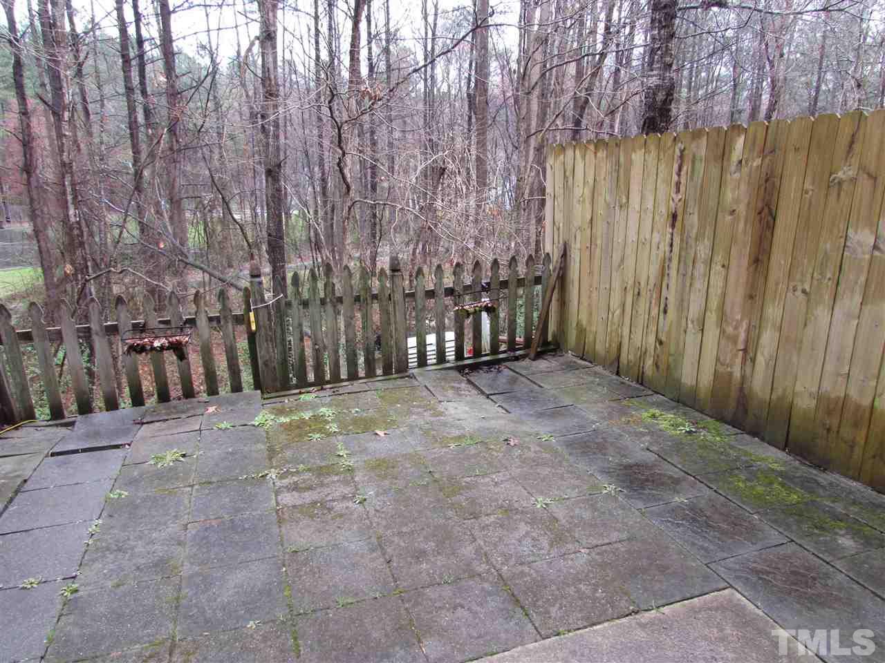 7750 Sandra Lane Raleigh, NC 27615 - Photo 22 of 25 a view of outdoor space with wooden fence