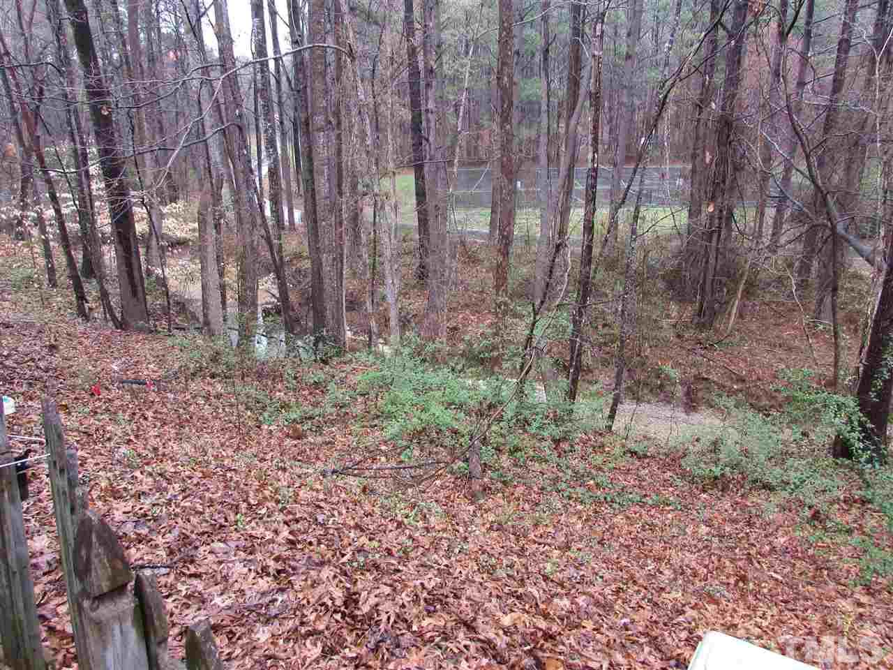 7750 Sandra Lane Raleigh, NC 27615 - Photo 23 of 25 a view of a yard with large trees