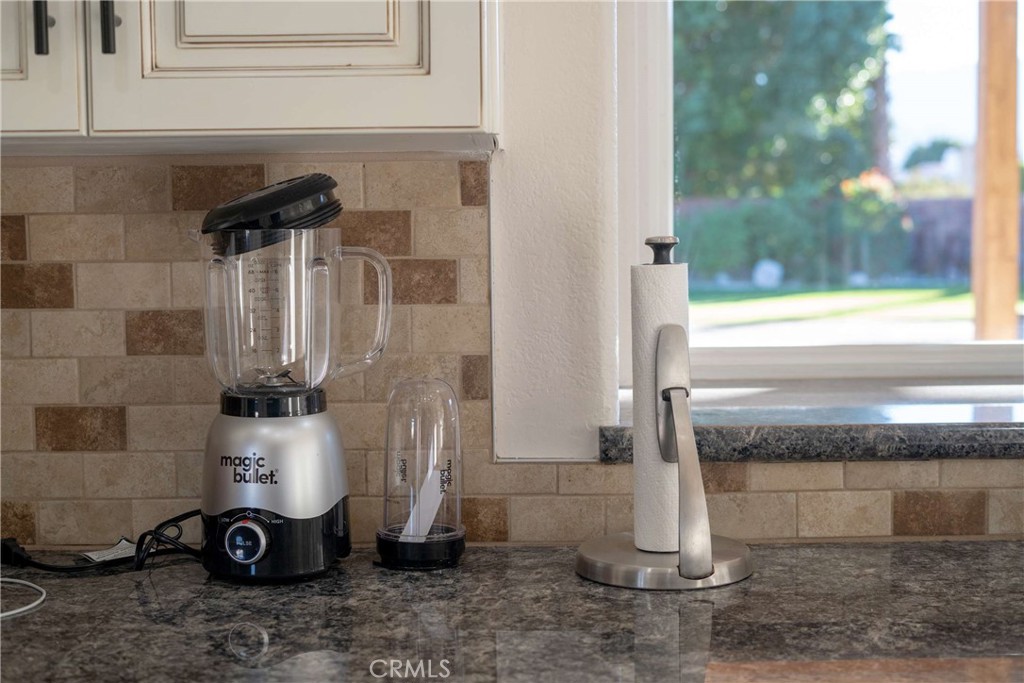 68845 Durango Road Cathedral City, CA 92234 - Photo 19 of 75 a bathroom with a granite countertop sink and a mirror