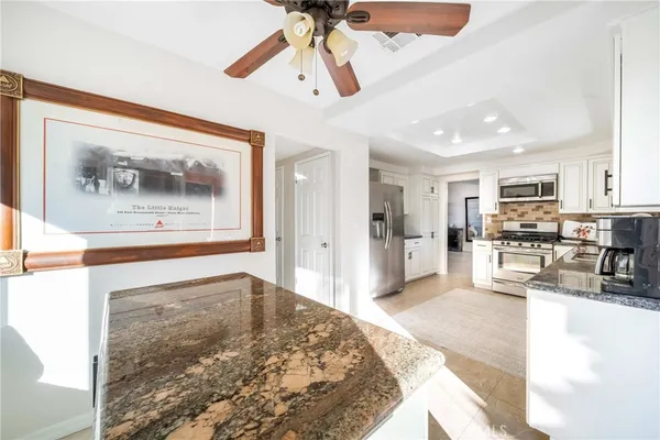 a spacious bedroom with a bed and a window