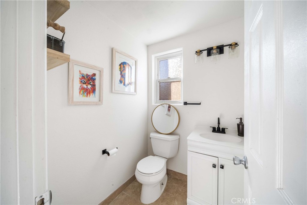 68845 Durango Road Cathedral City, CA 92234 - Photo 32 of 75 a white toilet sitting next to a bathroom sink