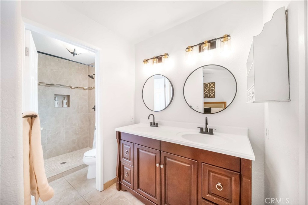 68845 Durango Road Cathedral City, CA 92234 - Photo 39 of 75 a bathroom with a toilet sink and mirror