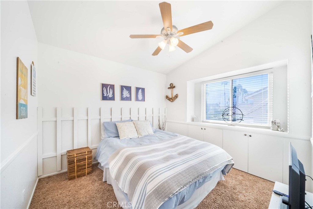 68845 Durango Road Cathedral City, CA 92234 - Photo 40 of 75 a bedroom with a large bed and a chandelier