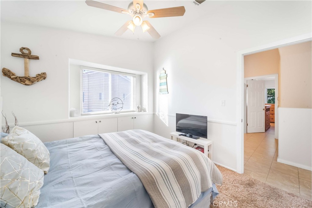 68845 Durango Road Cathedral City, CA 92234 - Photo 42 of 75 a bedroom with a bed and a chandelier