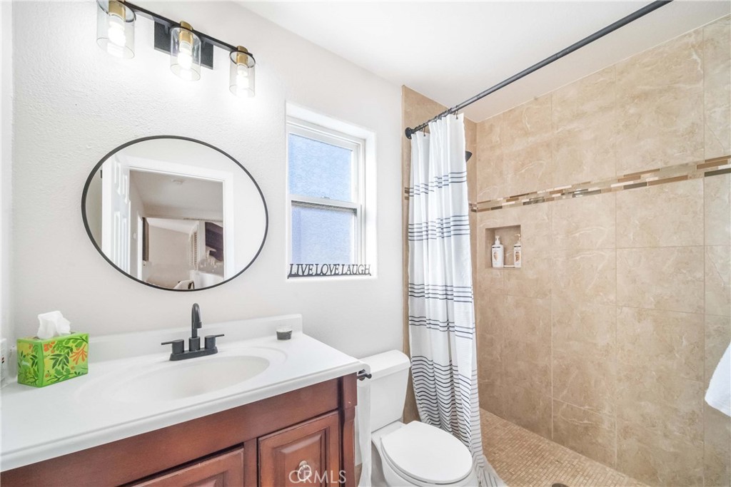 68845 Durango Road Cathedral City, CA 92234 - Photo 44 of 75 a bathroom with a sink a toilet and a mirror