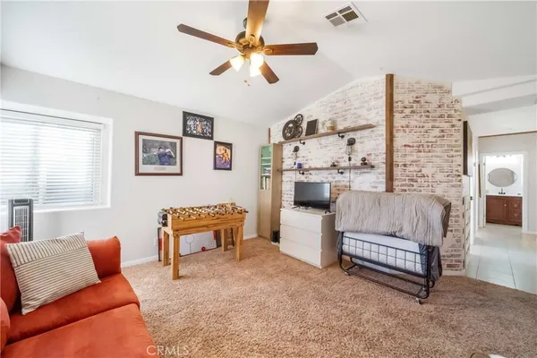 a view of a swimming pool with a yard and plants