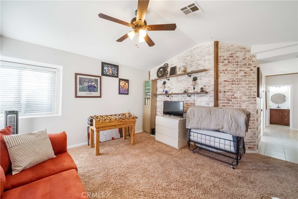 68845 Durango Road Cathedral City, CA 92234 - Photo 49 of 75 a living room with furniture and a large window