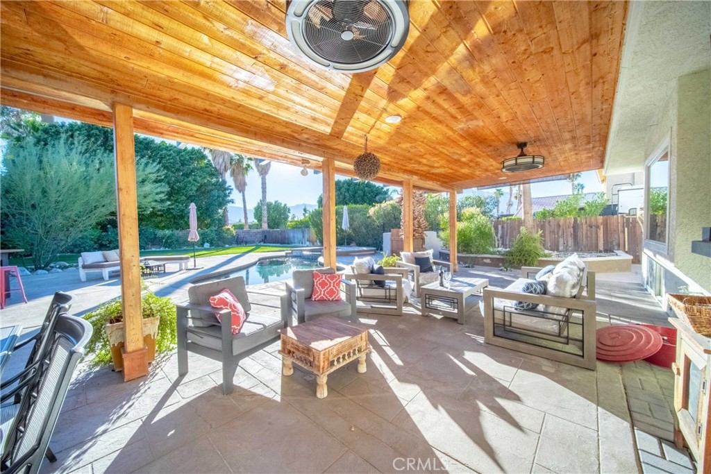68845 Durango Road Cathedral City, CA 92234 - Photo 66 of 75 a view of a patio with a dining table and chairs