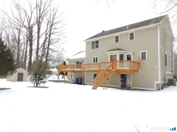 a building that has a tree in front of it