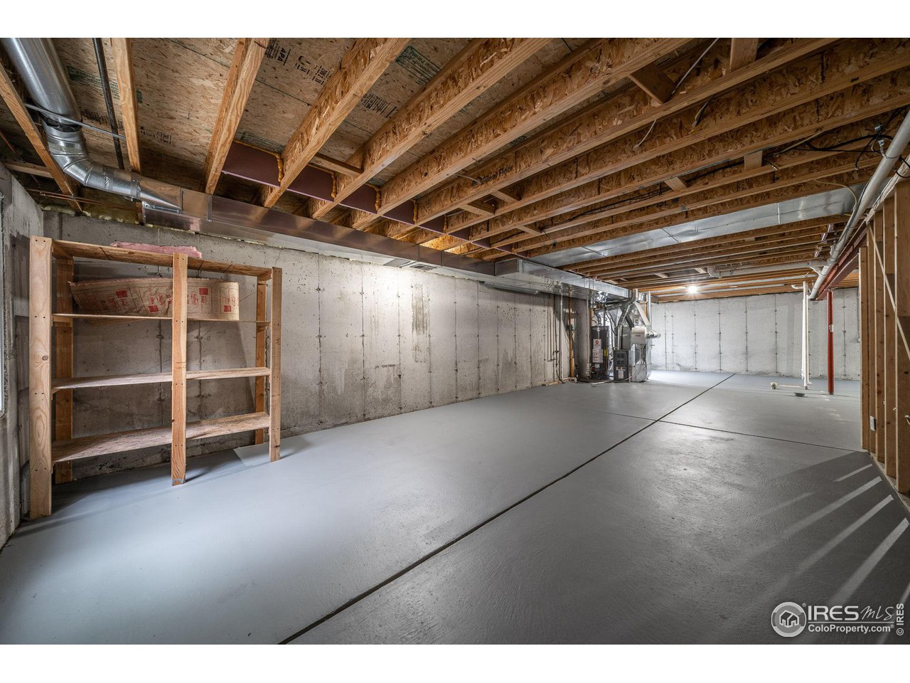 1021 East 25th St Road Greeley, CO 80631 - Photo 13 of 22 a view of an empty room with a fireplace