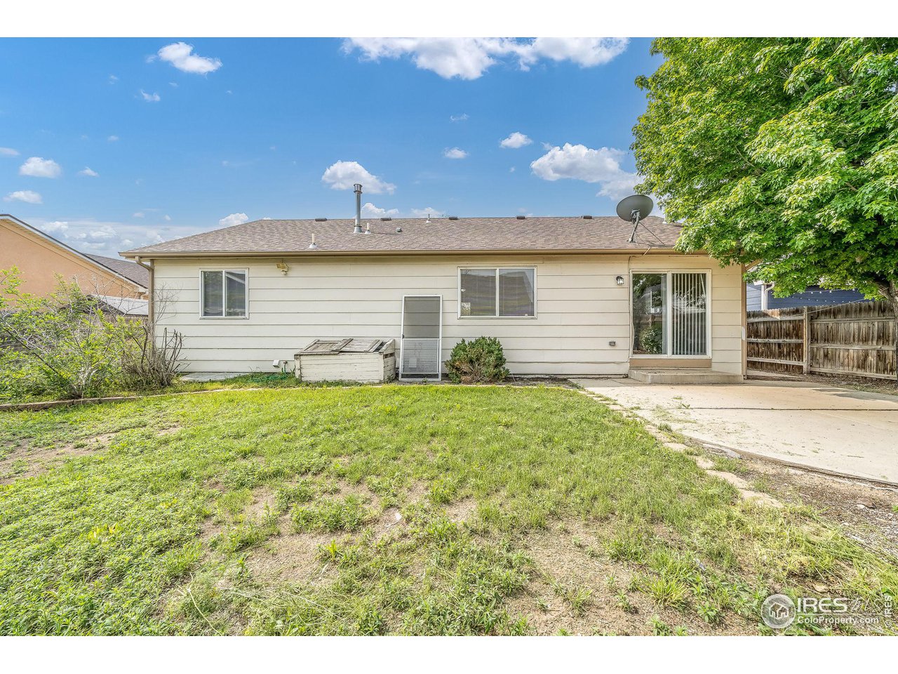 1021 East 25th St Road Greeley, CO 80631 - Photo 20 of 22 a view of a house with backyard and garden