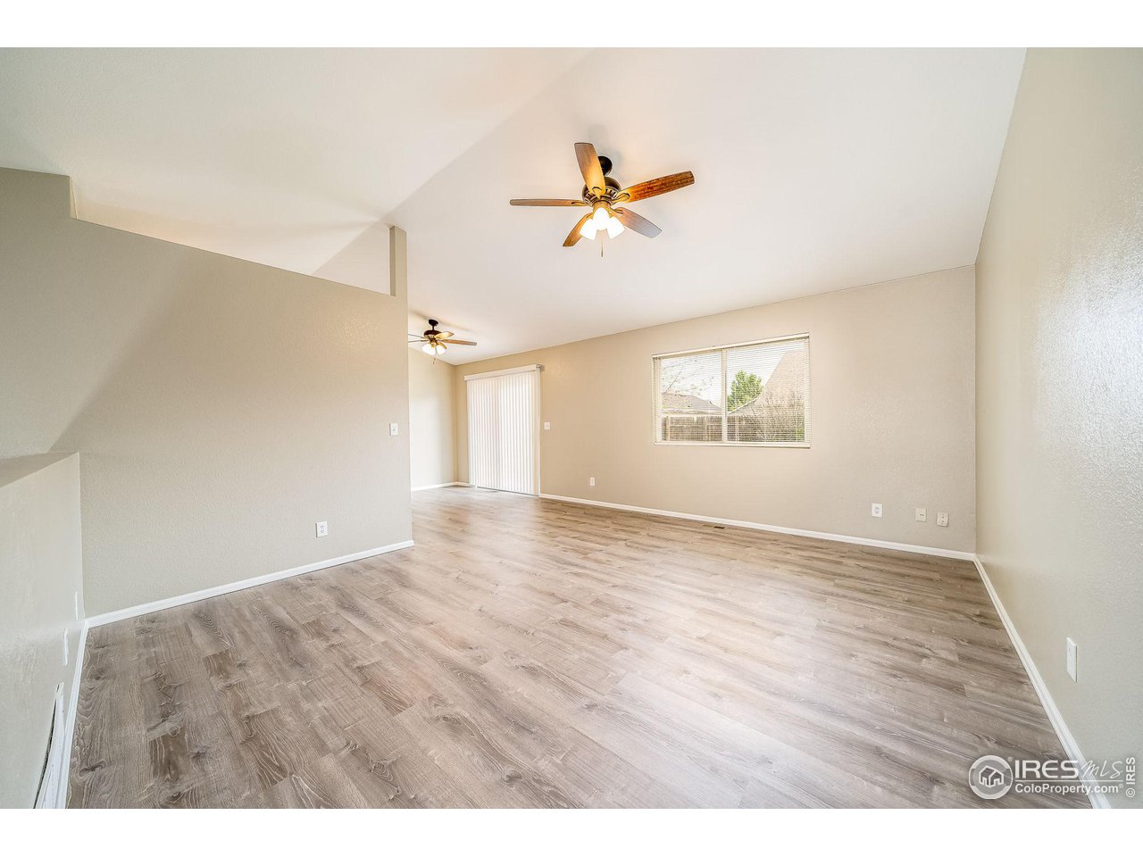 1021 East 25th St Road Greeley, CO 80631 - Photo 3 of 22 a view of an empty room with a window