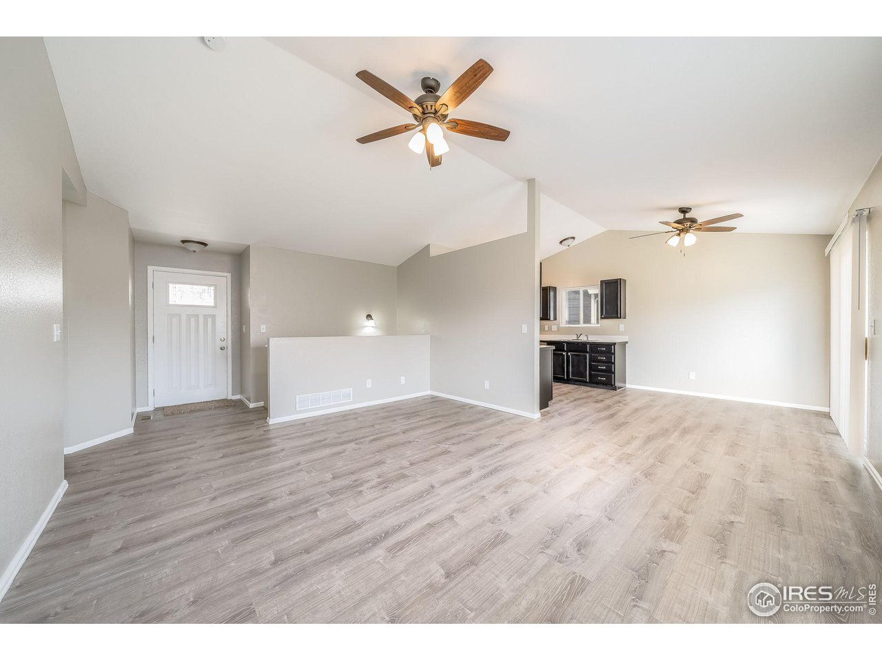 1021 East 25th St Road Greeley, CO 80631 - Photo 4 of 22 a view of an empty room and window