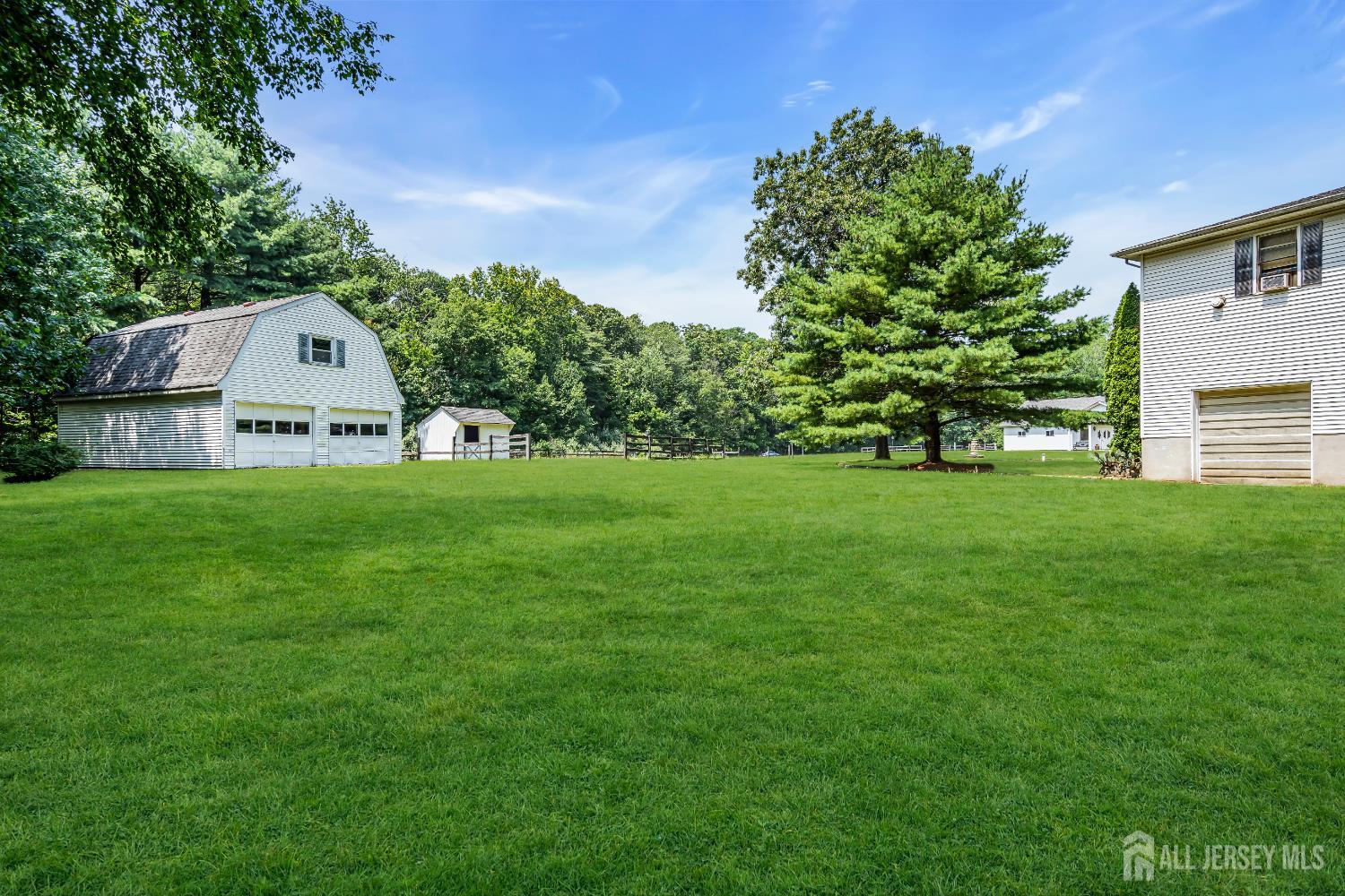 447 Stagecoach Road Millstone Township, NJ 08510 - Photo 22 of 46 a view of a house with a big yard and large trees