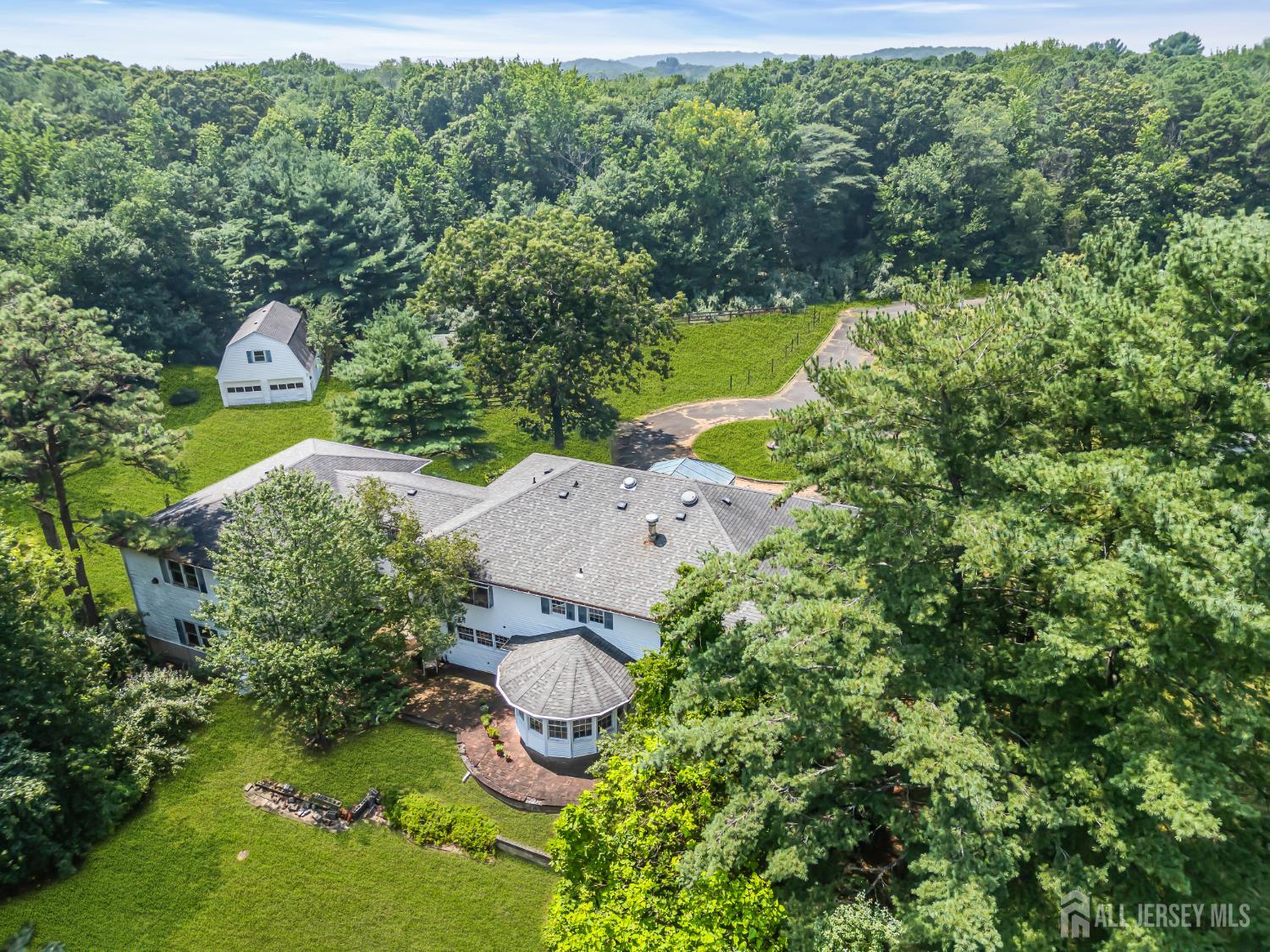 447 Stagecoach Road Millstone Township, NJ 08510 - Photo 26 of 46 an aerial view of a house with a yard