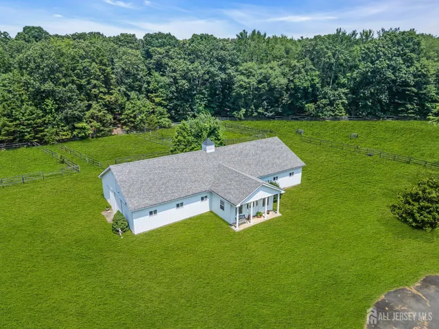 an aerial view of a house with a garden