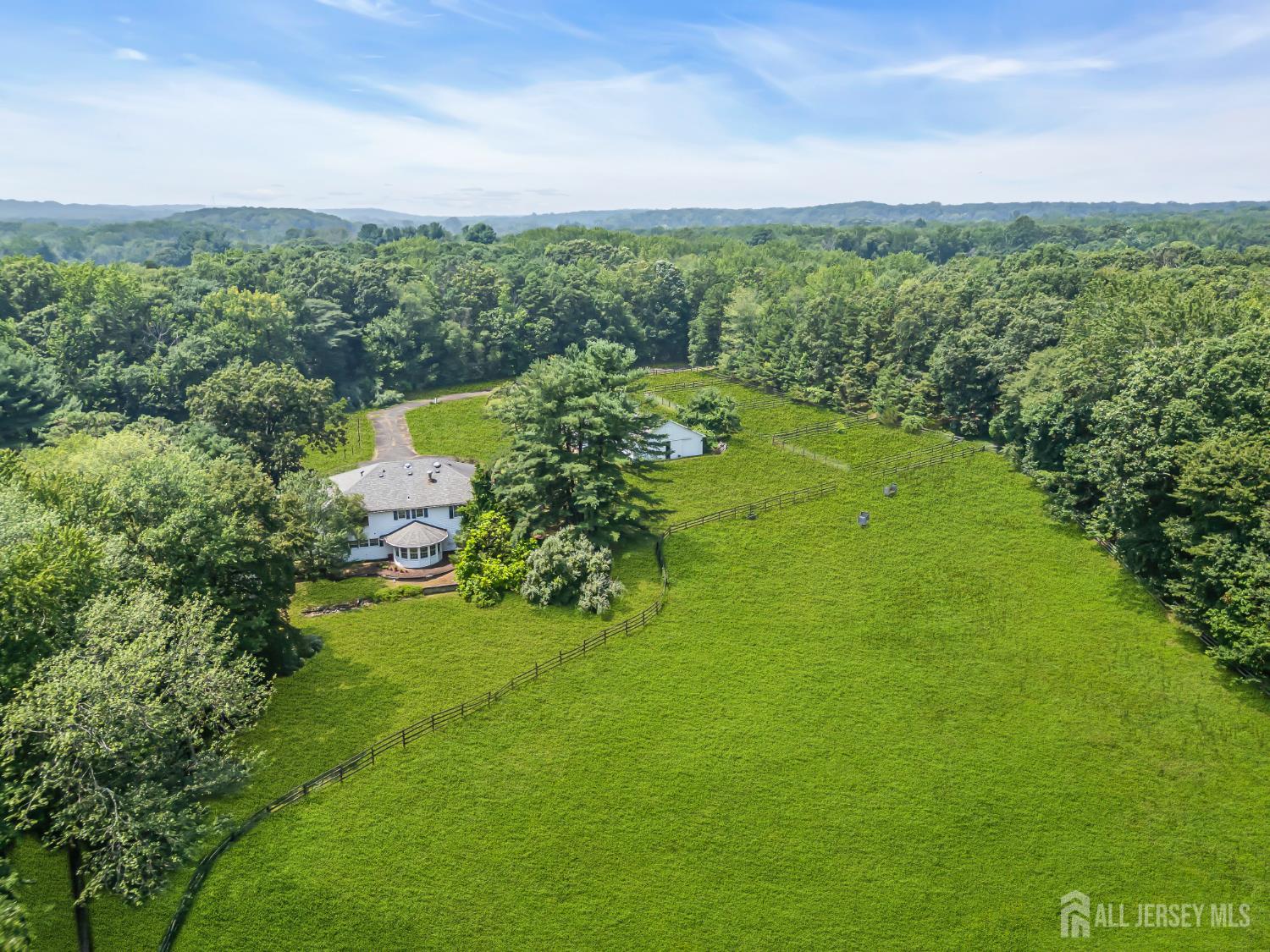 447 Stagecoach Road Millstone Township, NJ 08510 - Photo 32 of 46 a view of a lake with a yard