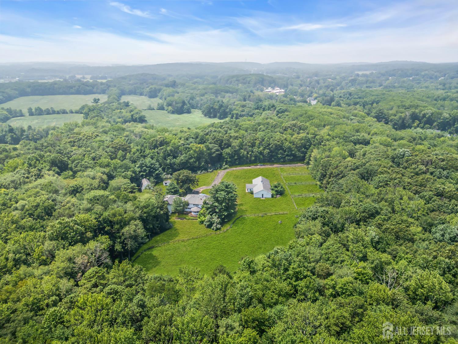 447 Stagecoach Road Millstone Township, NJ 08510 - Photo 38 of 46 an aerial view of residential house with outdoor space and trees all around