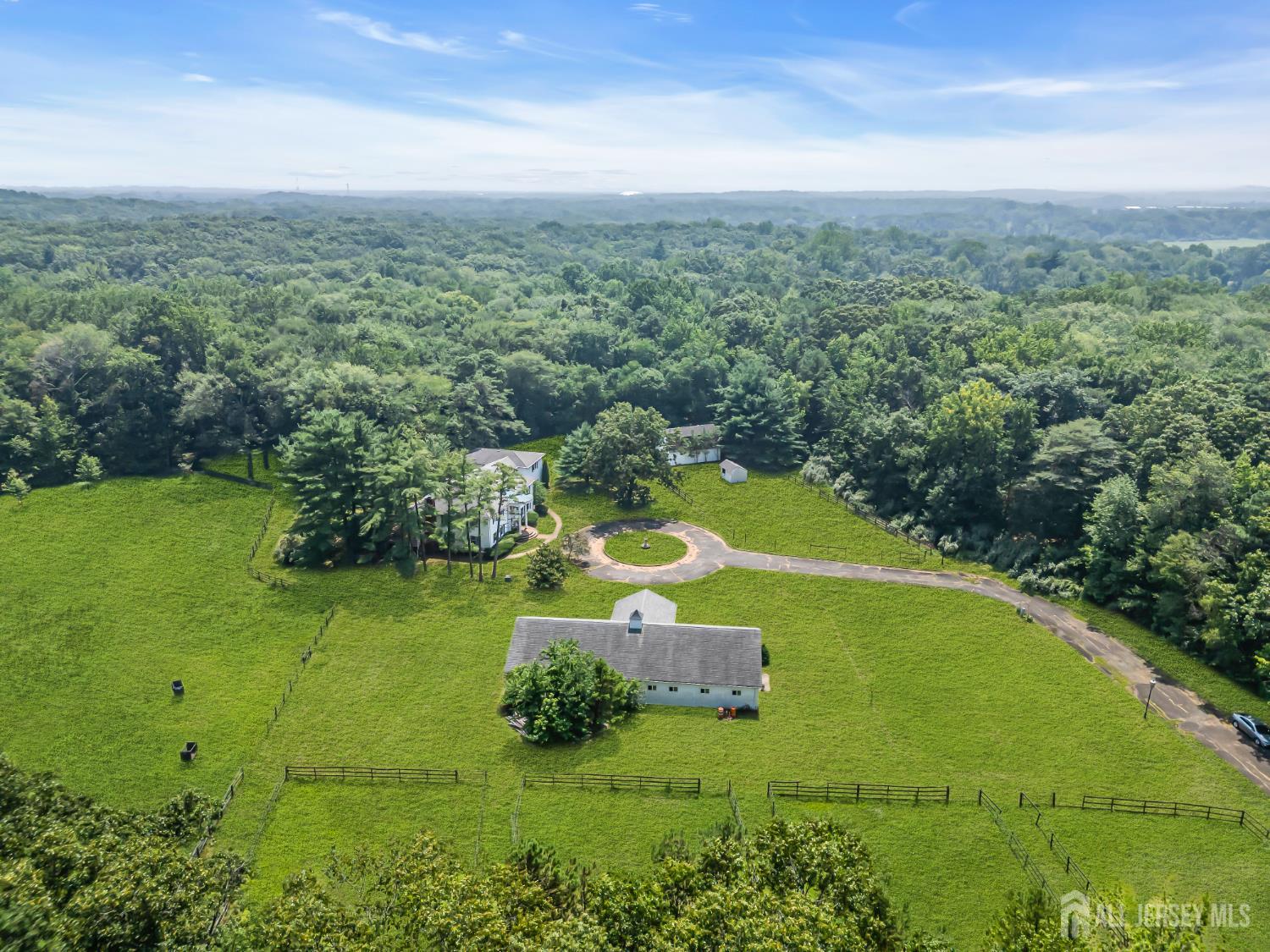 447 Stagecoach Road Millstone Township, NJ 08510 - Photo 45 of 46 a view of a grassy area with an trees