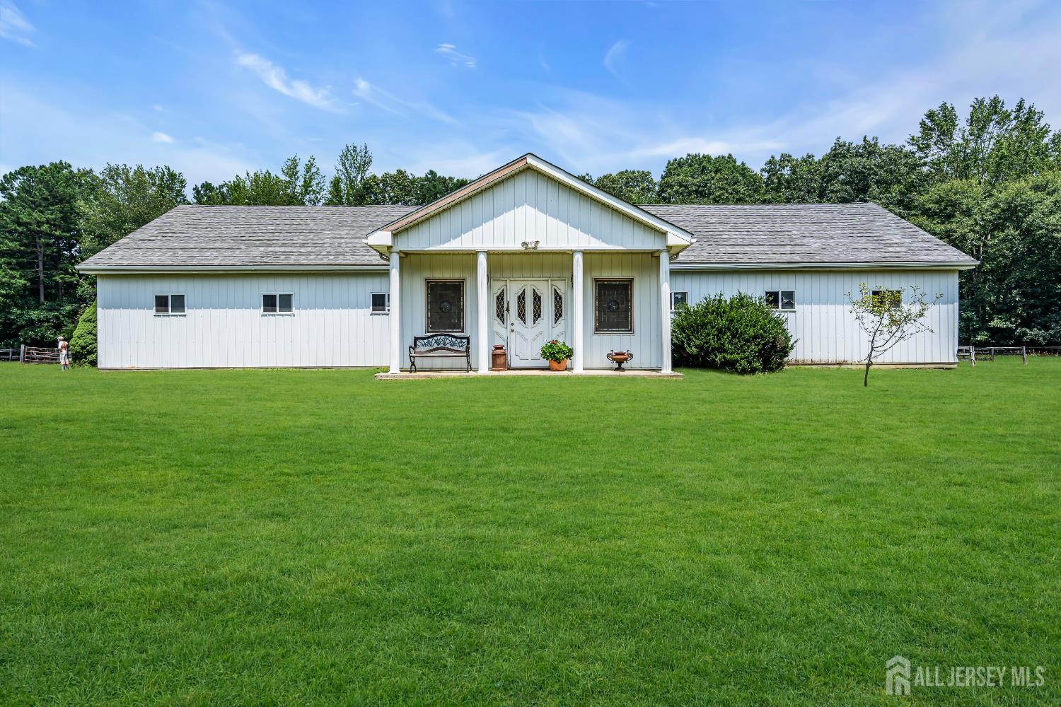 447 Stagecoach Road Millstone Township, NJ 08510 - Photo 7 of 46 a front view of a house with yard and green space