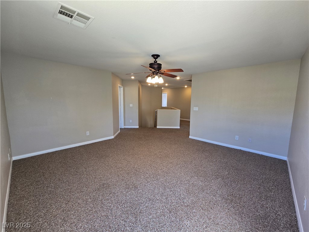 5508 Knotting Pass Las Vegas, NV 89131 - Photo 18 of 45 Carpeted spare room with ceiling fan and recessed lighting