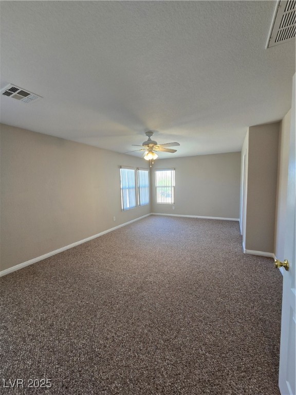 5508 Knotting Pass Las Vegas, NV 89131 - Photo 19 of 45 Spare room featuring carpet, a textured ceiling, and ceiling fan