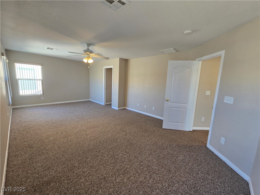 5508 Knotting Pass Las Vegas, NV 89131 - Photo 21 of 45 Carpeted empty room with baseboards and ceiling fan