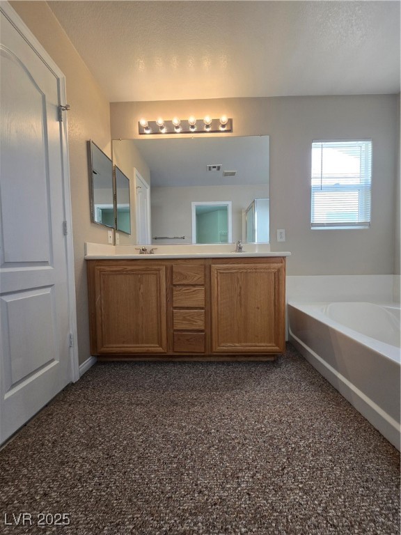 5508 Knotting Pass Las Vegas, NV 89131 - Photo 25 of 45 Full bathroom with a garden tub and double vanity