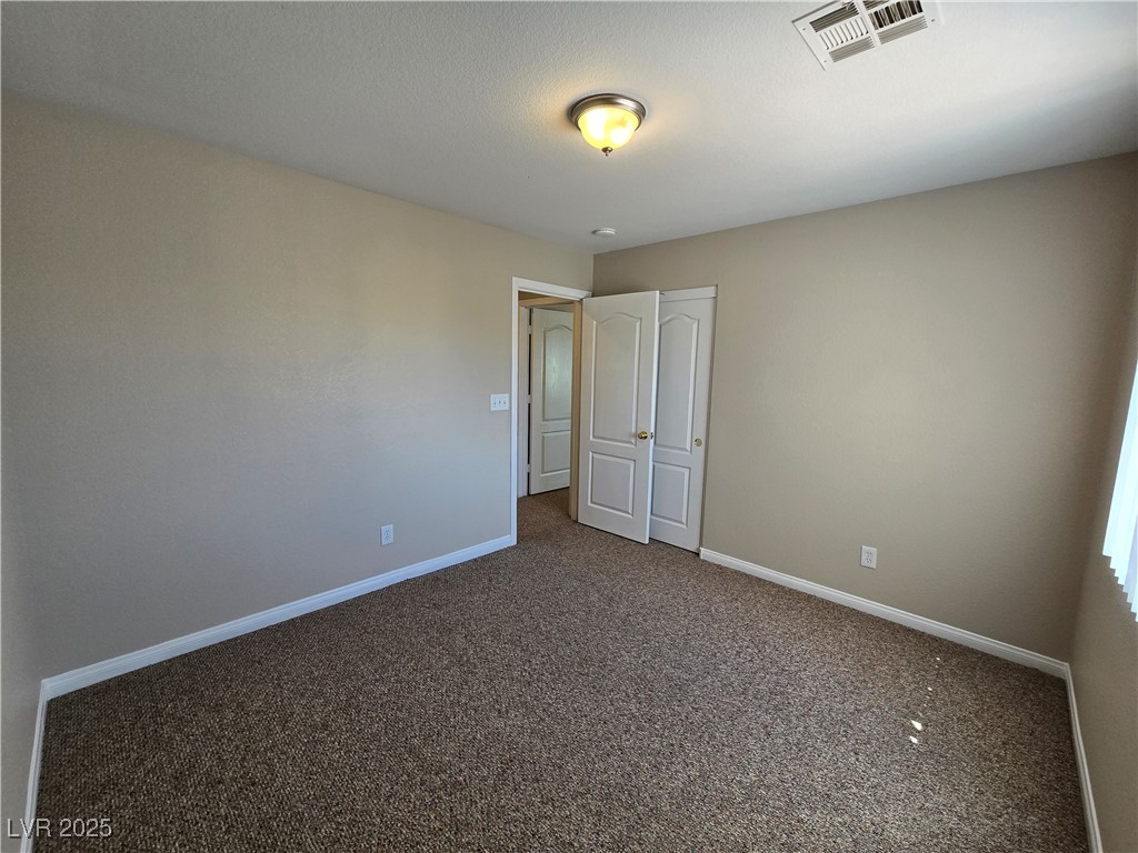 5508 Knotting Pass Las Vegas, NV 89131 - Photo 36 of 45 Unfurnished bedroom featuring carpet and baseboards