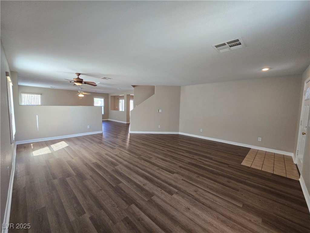 5508 Knotting Pass Las Vegas, NV 89131 - Photo 5 of 45 Unfurnished living room with dark wood-style floors and ceiling fan