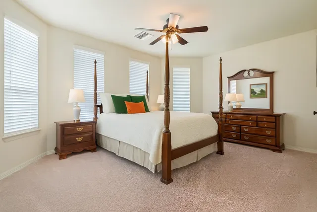 a bathroom with a sink a mirror and a shower