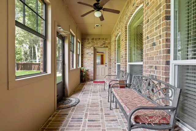 a view of a chairs and table in the backyard