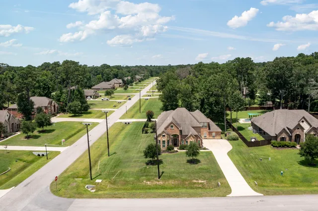 a view of a city with lawn chairs next to a yard