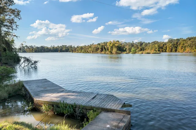 a view of a lake with a yard