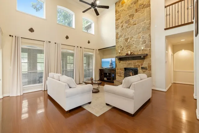 a spacious bedroom with a bed a table and chairs