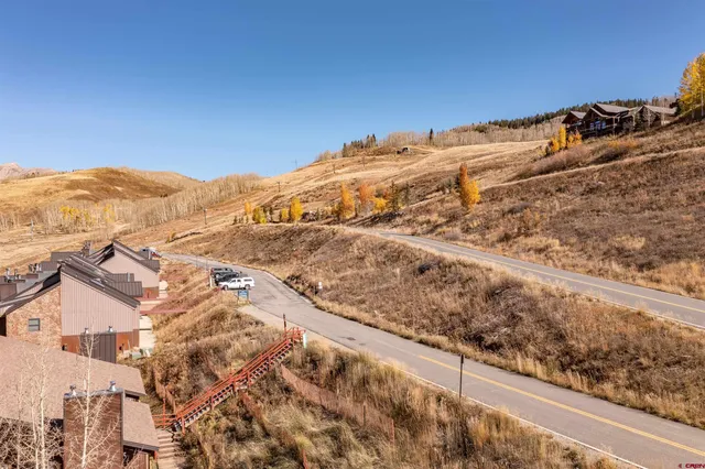 an aerial view of residential houses with a outdoor space