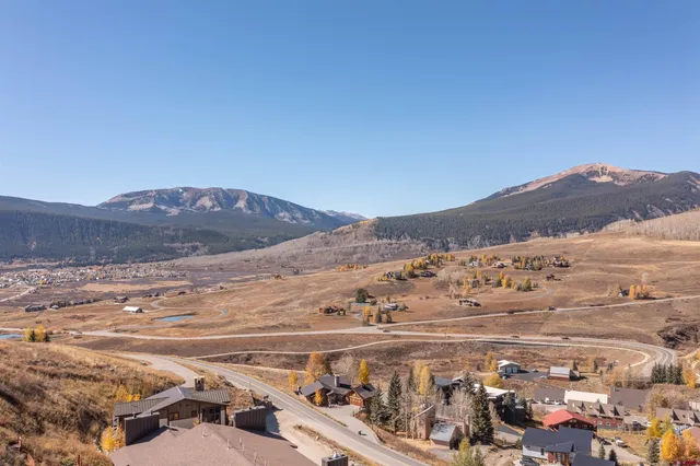 a view of mountain with an ocean