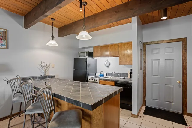 a view of a dining table and chairs in the kitchen