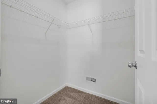 a bathroom with a toilet a sink and shower