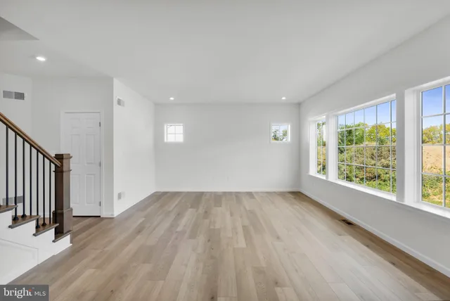 a kitchen with stainless steel appliances kitchen island a sink stove and cabinets