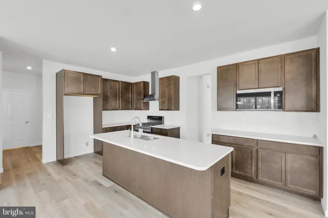 a bathroom with a sink mirror and toilet