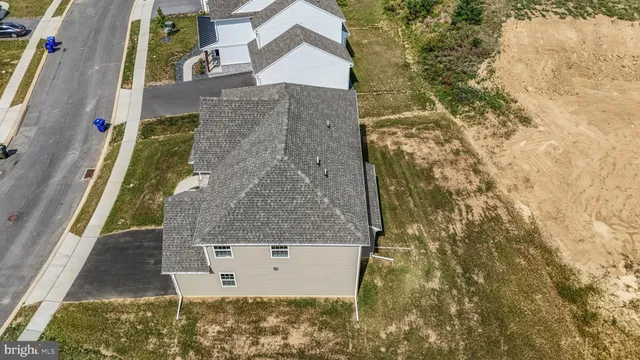 a aerial view of a house with a yard