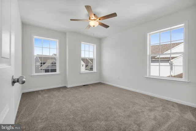 an empty room with windows