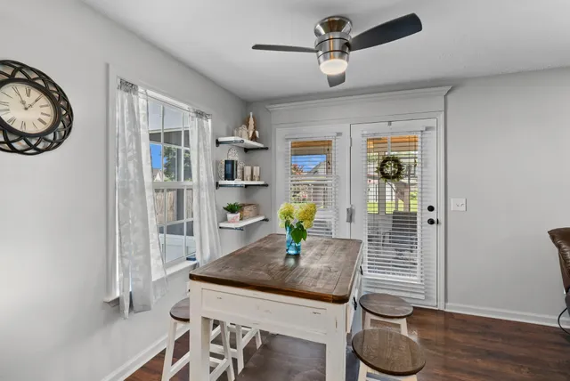 a kitchen with stainless steel appliances granite countertop a sink stove refrigerator and cabinets