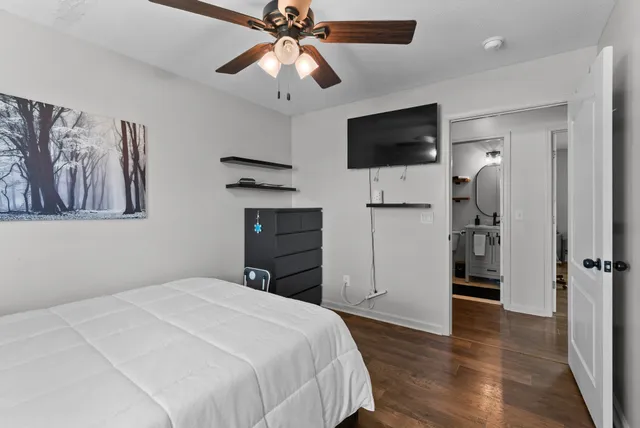 a living room with furniture and floor to ceiling windows