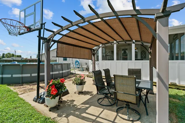 a view of yard with patio